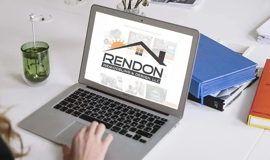 Photo of person using a computer to access the Rendon Remodeling website.