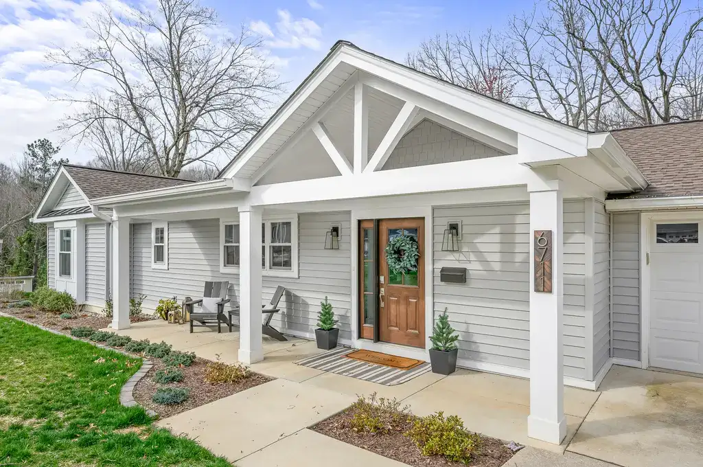 Front porch of beautiful white wooden house in suburbs
