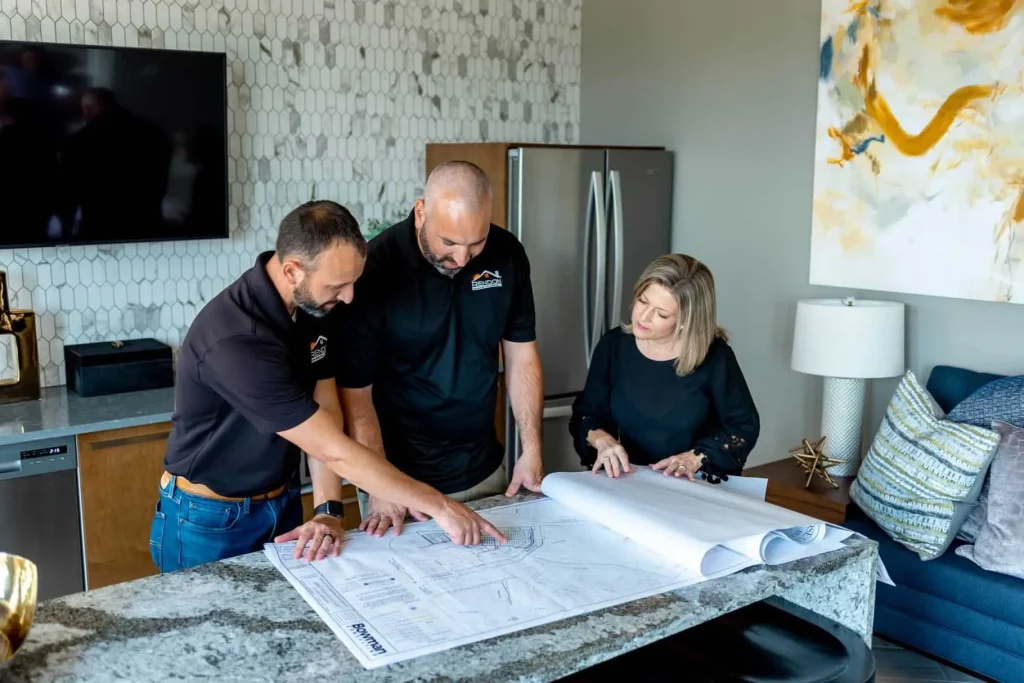 Homeowner planning remodeling priorities and budget with a contractor